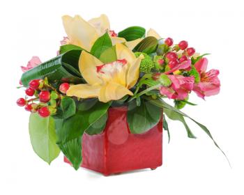 colorful floral bouquet of roses, cloves and orchids arrangement centerpiece in vase isolated on white background