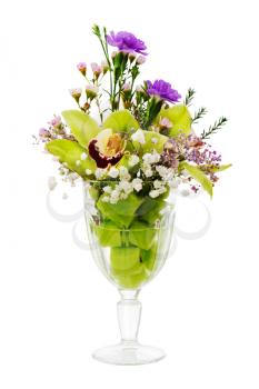 Floral bouquet of orchids, roses and carnation arrangement centerpiece in glass vase isolated on white background
