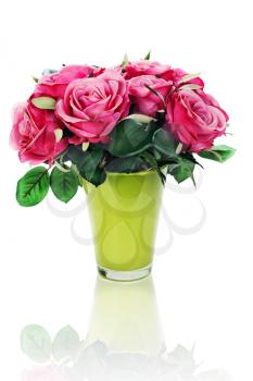 Colorful flower bouquet from artificial roses arrangement centerpiece in vase isolated on white background