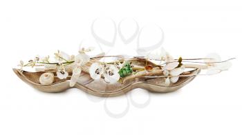 Composition from pearls, coral and orchids isolated on white background.
