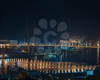 Night View of Bridge in Russian Vladivostok over Golden Horn (Zolotoy Rog) Bay.
