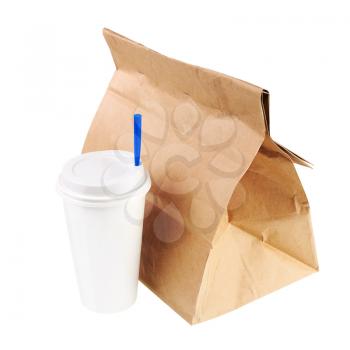 Lunch brown recycle paper bag and cup of coffee or tea with blue tube for drinking isolated on white background. Side view.