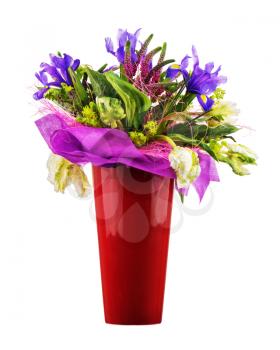 Beautiful bouquet of tulips, iris, veronica and other flowers in red vase isolated on white background. 