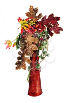 Christmas arrangement of Christmas balls, artificial flowers, beads and pine branches in vase isolated on white background.