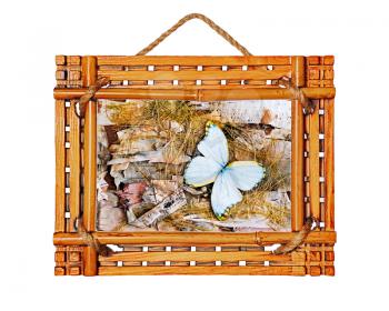 Bamboo photo frame with abstract composition of butterflies, birch bark and straw isolated on white background.
