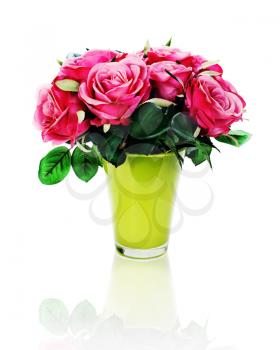 Colorful flower bouquet from artificial roses arrangement centerpiece in vase isolated on white background