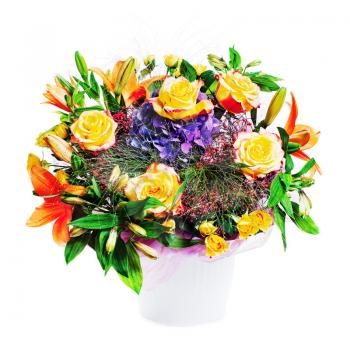 Flower bouquet arrangement centerpiece in vase isolated on white background.