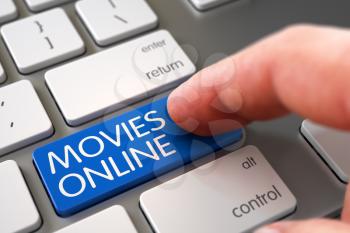 Movies Online - Aluminum Keyboard Keypad. Selective Focus on the Movies Online Button. Hand Touching Movies Online Keypad. Finger Pushing Movies Online Keypad on Modern Laptop Keyboard. 3D.
