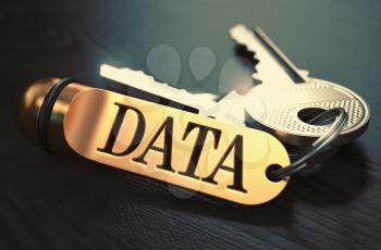 Keys with Word 'Data' on Golden Label over Black Wooden Background. Closeup View, Selective Focus, 3D Render. Toned Image.