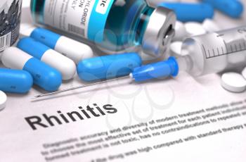 Rhinitis - Printed Diagnosis with Blurred Text. On Background of Medicaments Composition - Blue Pills, Injections and Syringe.