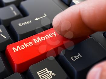 Make Money - Written on Red Keyboard Key. Male Hand Presses Button on Black PC Keyboard. Closeup View. Blurred Background.