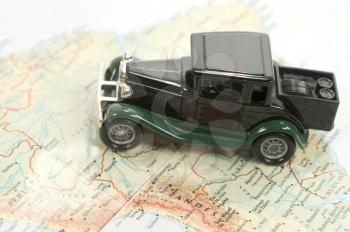 Toy car over a map of south america