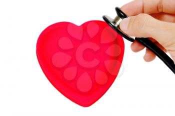 hand with stethoscope checking a pink heart isolated on white