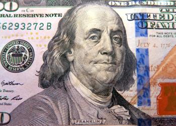 Macro shot of a brand new one hundred dollar bill showing the face of Benjamin Franklin     