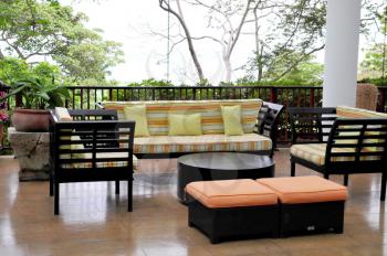 View of a set of furniture on a tropical deck