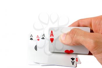 Hand holding a winning hand with four aces