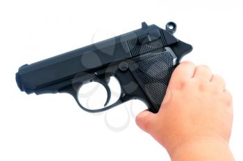 Child s hand holding a gun isolated on white