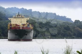 Large transport ship moving across Gatun Lake in the Panama Canal 
