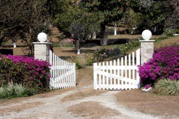 Small wooden white gate of a rural home