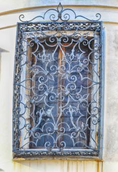 forged antique grille on the window