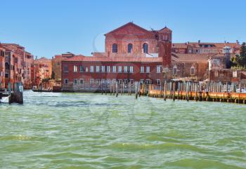 canal and abbey church view Venice Italy