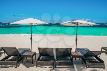 Beach umbrellas and loungers on perfect white beach, Boracay, Philippines
