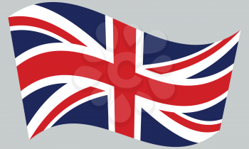 Flag of the United Kingdom waving on gray background