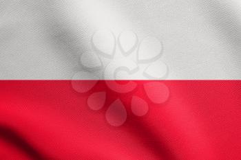 Flag of Poland waving in the wind with detailed fabric texture. Polish national flag.