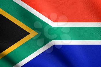 Flag of South Africa waving in the wind with detailed fabric texture. South African national flag.
