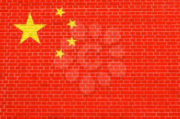 Flag of China on brick wall texture background. Chinese national flag.