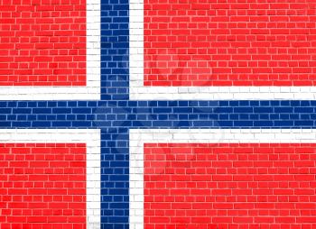 Flag of Norway on brick wall texture background. Norwegian national flag.
