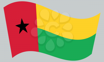Bissau-Guinean national official flag. Patriotic symbol, banner, element, background. Correct colors. Flag of Guinea-Bissau waving on gray background, vector