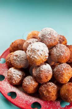 Crispy cheese balls deep fried in powdered sugar