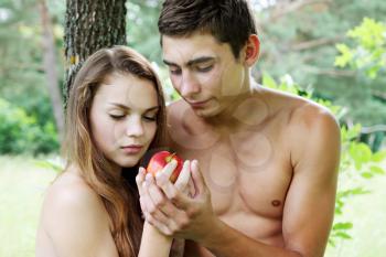 Adam and Eve with a red apple