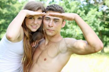 A young couple looks into the distance