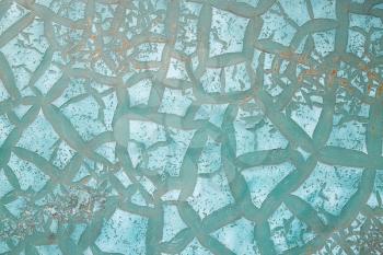  metal surface with old cracked turquoise paint
