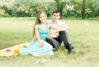 Portrait of a young romantic couple on nature