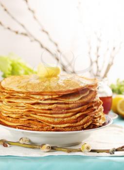 pile of thin pancakes on a plate