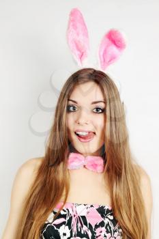 A beautiful young woman dressed in a rabbit ears