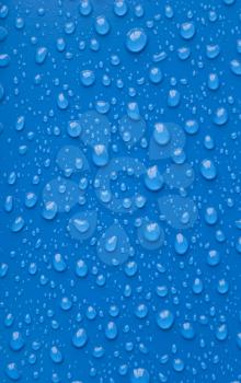 Water droplets on a blue background.