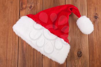 Santa hat on a wooden background.