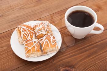 Sweet glaze cookies and a cup of coffee.