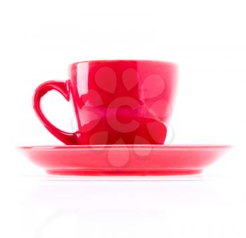 Beautiful colorful red cup mug on plate dish isolated on white background