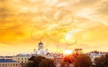 Cityscape And Helsinki Cathedral At Sunset With Dramatic Sky.