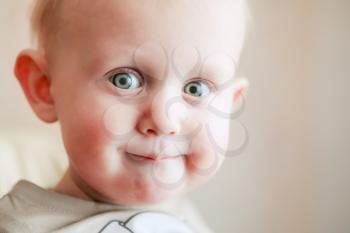 Close Up Portrait One Year Old Little Child Baby Boy Smiling And Looking At Camera