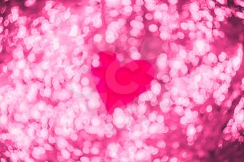 Red heart on pink bokeh abstract light Valentine's day background