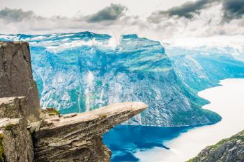 Scenic View Of Rock Trolltunga - Troll Tongue In Norway. Rock In The Mountains Of Norway. Natural Attractions Landmark