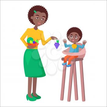 Young African mother with a bowl full of fruits gives grapes to baby boy, who sits on highchair on white background. Motherhood concept. Cartoon family moment vector illustration for Mother day.