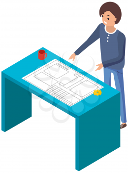 Man stand by table with paper plan. Person work on mockup of machinery. Architect or designer working on factory. Product development and project planning. Employee analyzes layout on paper