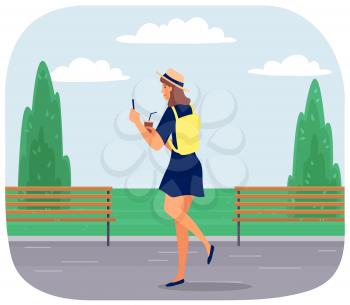 Young happy woman walking in park with mobile phone and coffee using smartphone to share posts and news in social networks, chatting with friends. Girl holds smart phone to make repost of video